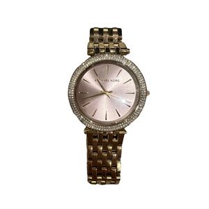 Michael Kors gold watch with diamonds around with light pink face